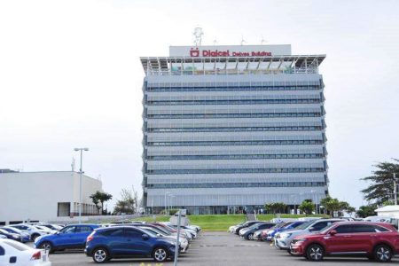 Fitch Ratings has downgraded Digicel and threatens a further downgrade if the company restructures its debt rather than meet payments as scheduled on March 1. 