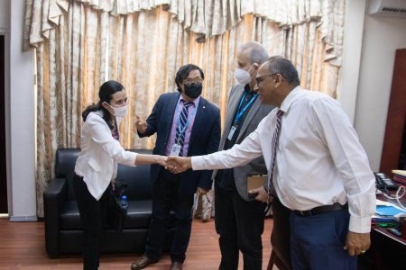 Health Minister, Dr Frank Anthony (right) meeting a member of the team. (Ministry of Health photo)
