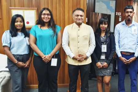 Indian High Commissioner to Guyana Dr KJ Srinivasa (centre) with the four KIP participants. (Indian High Commission photo)