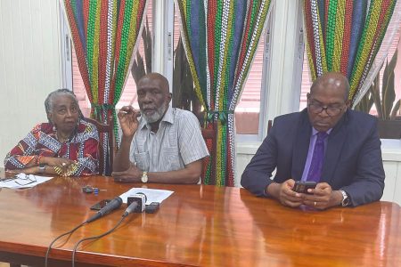 From left: IDPADA-G CEO Olive Sampson, Chairman of IDPADA-G’s Coordinating Council Vincent Alexander and attorney Nigel Hughes