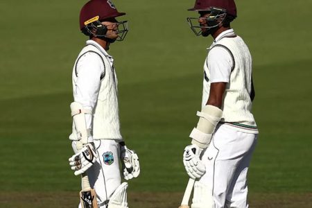 West Indies openers Tagenarine Chanderpaul and Kraigg Brathwaite converse during their double century opening stand yesterday.