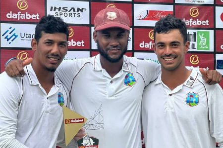 MATCH WINNERS! West Indies test captain Kraigg Brathwaite embraces his two match winners Gudakesh Motie, left and Tagenarine Chanderpaul.