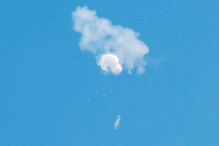 The suspected Chinese spy balloon drifts to the ocean after being shot down off the coast in Surfside Beach, South Carolina, U.S. February 4, 2023. REUTERS/Randall Hill