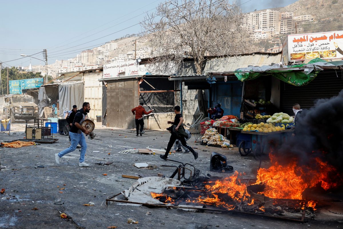 Palestinians clash with Israeli forces during a raid in Nablus in the Israeli-occupied West bank, February 22, 2023. REUTERS/Raneen Sawafta