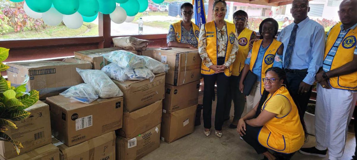 Members of the Georgetown Lions Club and Dr Keith Cummings (standing second from right) with some of the medical supplies that were presented to the Linden Hospital Complex