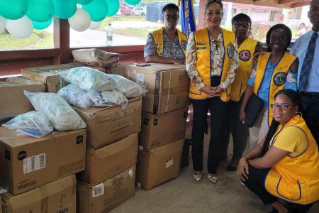 Members of the Georgetown Lions Club and Dr Keith Cummings (standing second from right) with some of the medical supplies that were presented to the Linden Hospital Complex