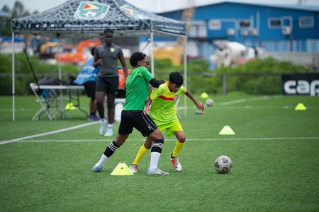 A scene from the Georgetown and West Demerara clash in the Tiger Rentals/Guyana Football Federation Boys U13 League yesterday at the National Training Centre, Providence