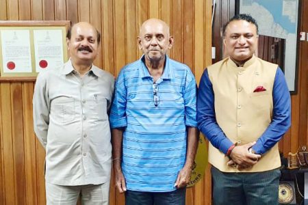 Historian, Professor Tota Mangar (centre) with Indian High Commissioner to Guyana, Dr. K. J. Srinivasa (right). (Indian High Commission photo)