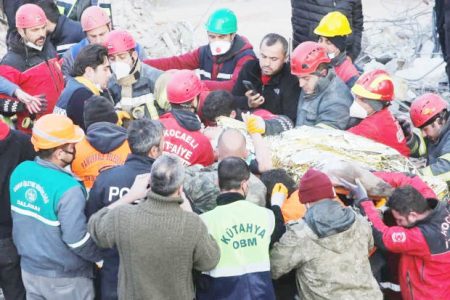 Rescuer workers carry Kaan, a-13-year old Turkish teenager, to an ambulance after being rescued from the rubble after 182 hours, in the aftermath of a deadly earthquake in Hatay, Turkey February 13, 2023. REUTERS