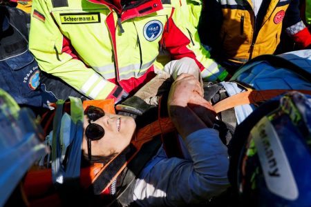 Rescuers carry a woman named Zeynep, as the search for survivors continues, in the aftermath of a deadly earthquake in Kirikhan, Turkey February 10, 2023. REUTERS/Piroschka van de Wouw