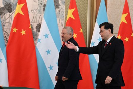 Chinese Foreign Minister Qin Gang shows the way to Honduras Foreign Minister Eduardo Enrique Reina as they arrive to issue a joint statement following the establishment of diplomatic relations between the two countries, at a ceremony in the Diaoyutai State Guesthouse in Beijing, China March 26, 2023. Greg Baker/Pool via REUTERS