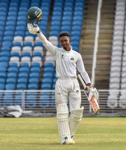 Alick Athanaze celebrating his hundred on day two against Leeward Islands Hurricanes