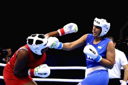 Nupur Sheoran of India lands a crisp right hand to the face of Guyana’s Abiola Jackman who suffered a unanimous decision loss in her opening round-of-16 bout at the ongoing International Boxing Association (IBA) Women’s World Boxing Championships in India yesterday.