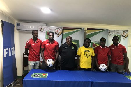 Golden Jaguars head coach Jamaal Shabazz (centre) posing with members of the team and coaching staff following the official announcement of the CONCACAF Nations League roster. The other members from left are Daniel Wilson, Colin Nelson, Wayne Dover, Omari Glasgow and Jeremy Garrett