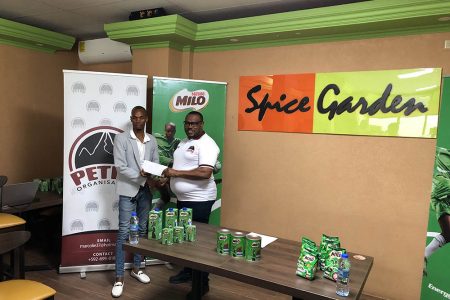 Petra Organization Co-Director Troy Mendonca (right) receiving the sponsorship cheque from Selwyn Abdool, PRO of MVP Sports