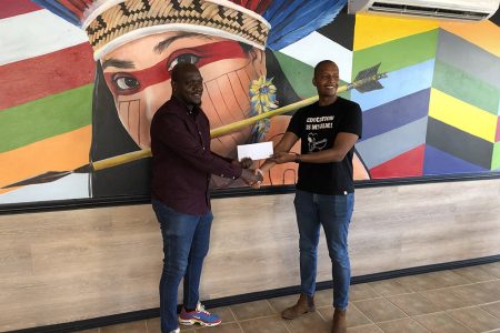 Tournament coordinator Rawle Toney (left) receiving the sponsorship cheque from German’s Restaurant proprietor Clinton Urling