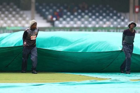 Ground staff at Buffalo Park in the process of covering the outfield as rain poured nonstop to eventually wash out the 1st ODI between hosts South Africa and the West Indies
