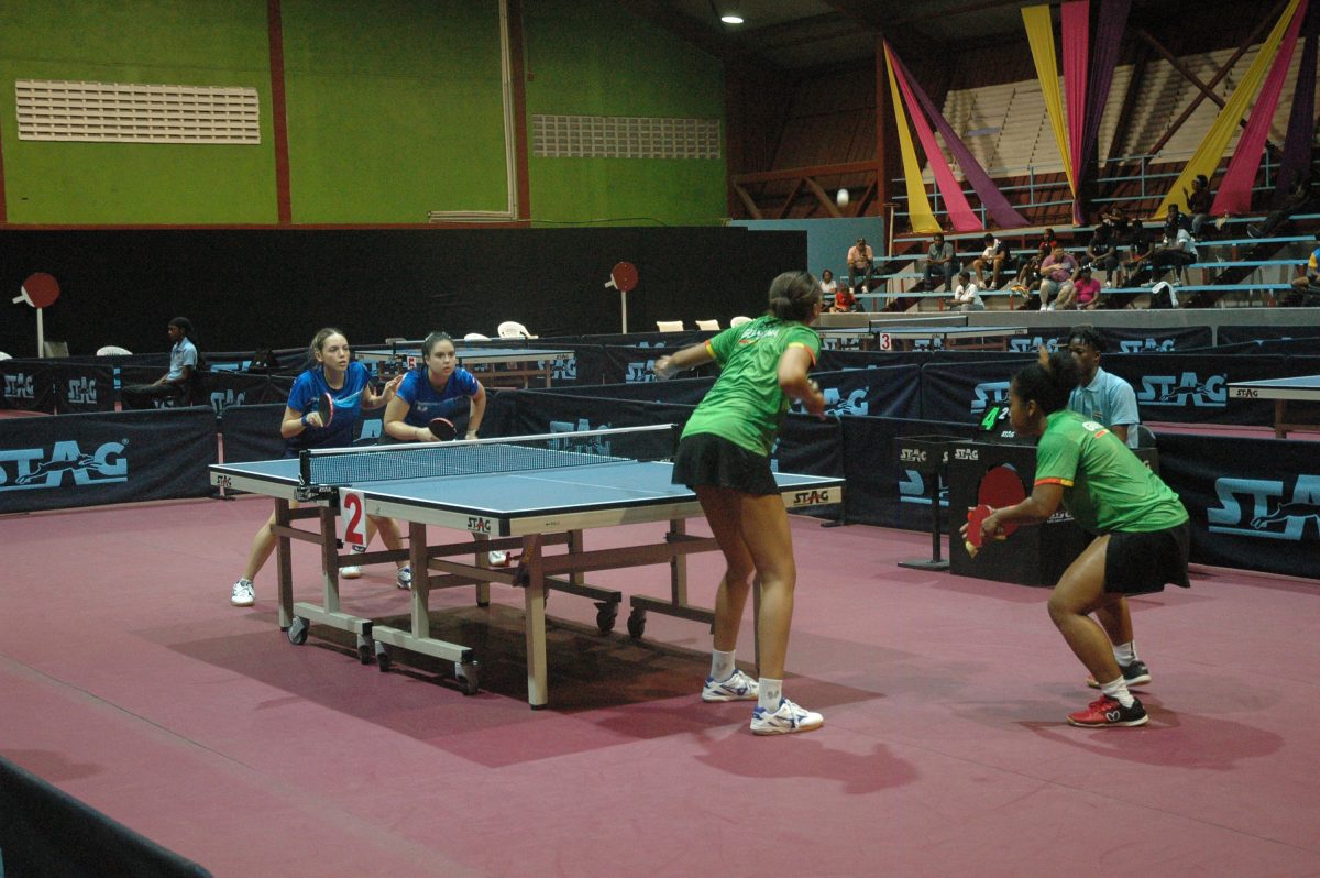 Tough Assignment! Natalie Cummings and Chelsea Edghill of Guyana battling away against Brianna Burgos and Daniely Rios of Puerto Rico in the women’s team section