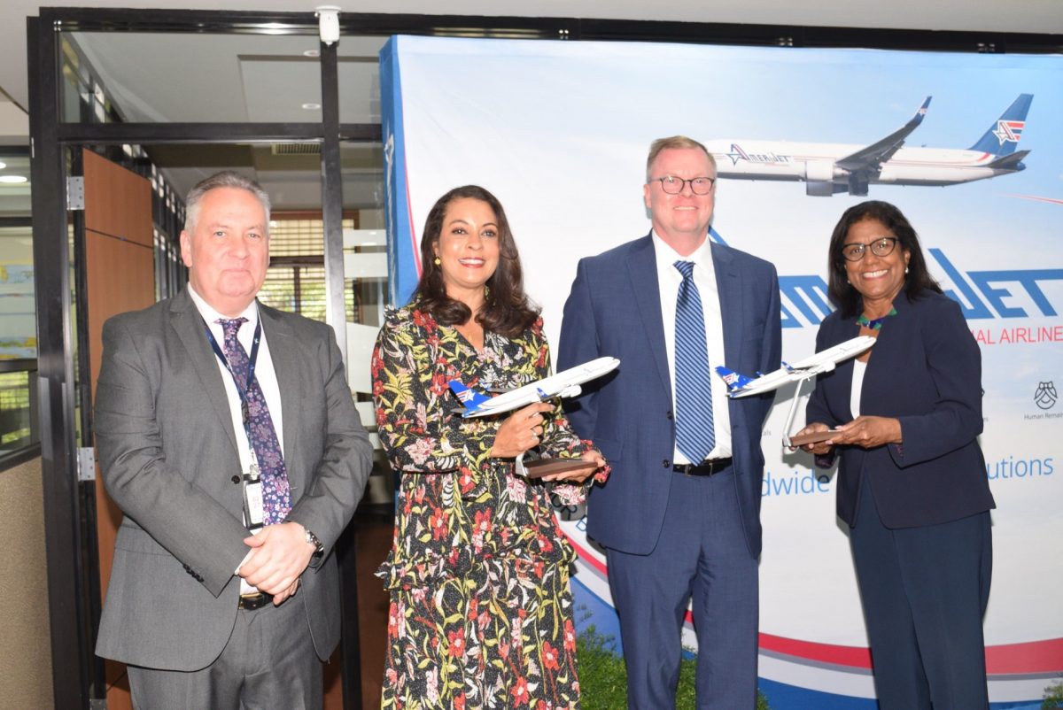 US Ambassador Candace Bond, second from left, and Minister of Trade and Industry Paula Gopee-Scoon, right, receive tokens from Amerijet’s director of revenue accounting, John Hagan, left, and chief financial officer Joe Moszzali, during the opening of Amerijet International Airlines at Victoria Avenue, Port-of-Spain, yesterday.

