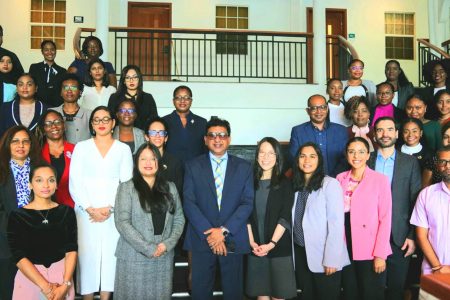 Attorney General Anil Nandlall SC with the trainers and trainees.