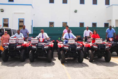 Minister of Health, Dr Frank Anthony second from left on one of the ATVs (Ministry of Health photo)