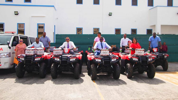 Minister of Health, Dr Frank Anthony second from left on one of the ATVs (Ministry of Health photo)