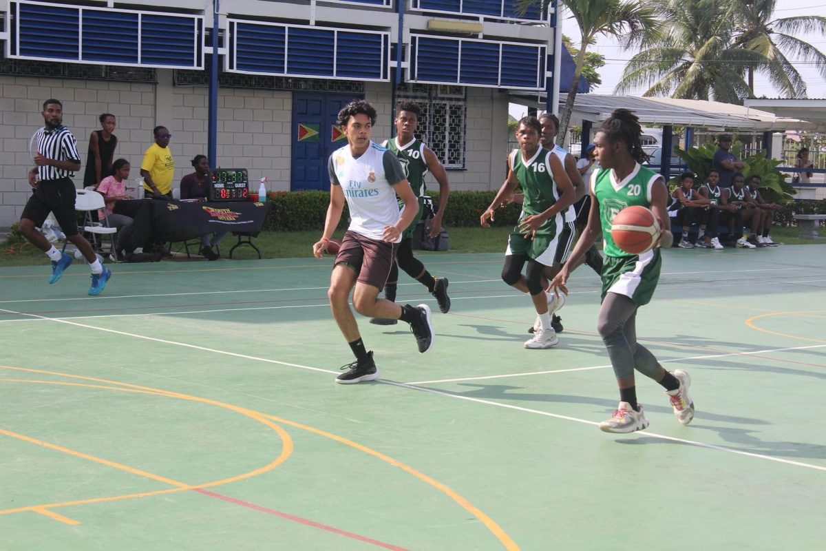 Part of the action between the Bishops’ High (green) and School of the Nations in the YBG Georgetown Regionals at the Marian Academy hard-court, Carifesta Avenue