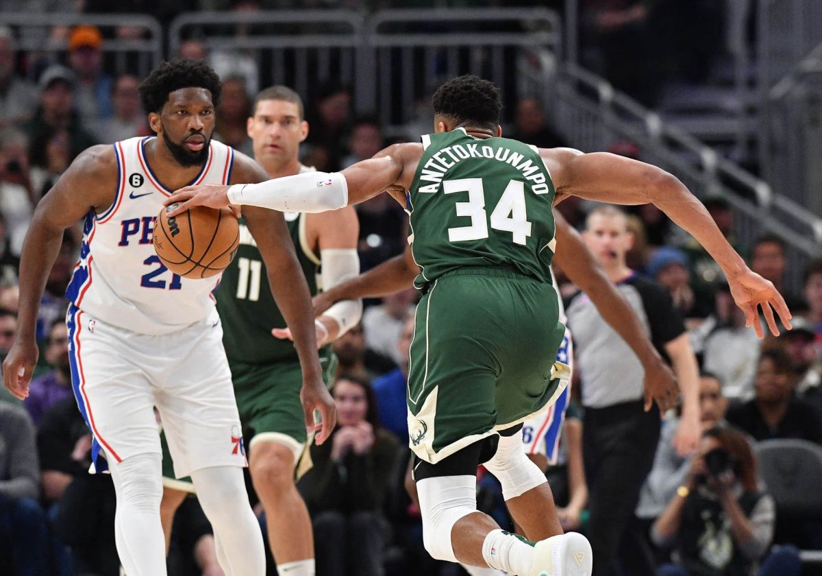 Milwaukee Bucks forward Giannis Antetokounmpo (34) drives to the basket against Philadelphia 76ers center Joel Embiid (21) in the second half at Fiserv Forum. Mandatory Credit: Michael McLoone-USA TODAY Sports

