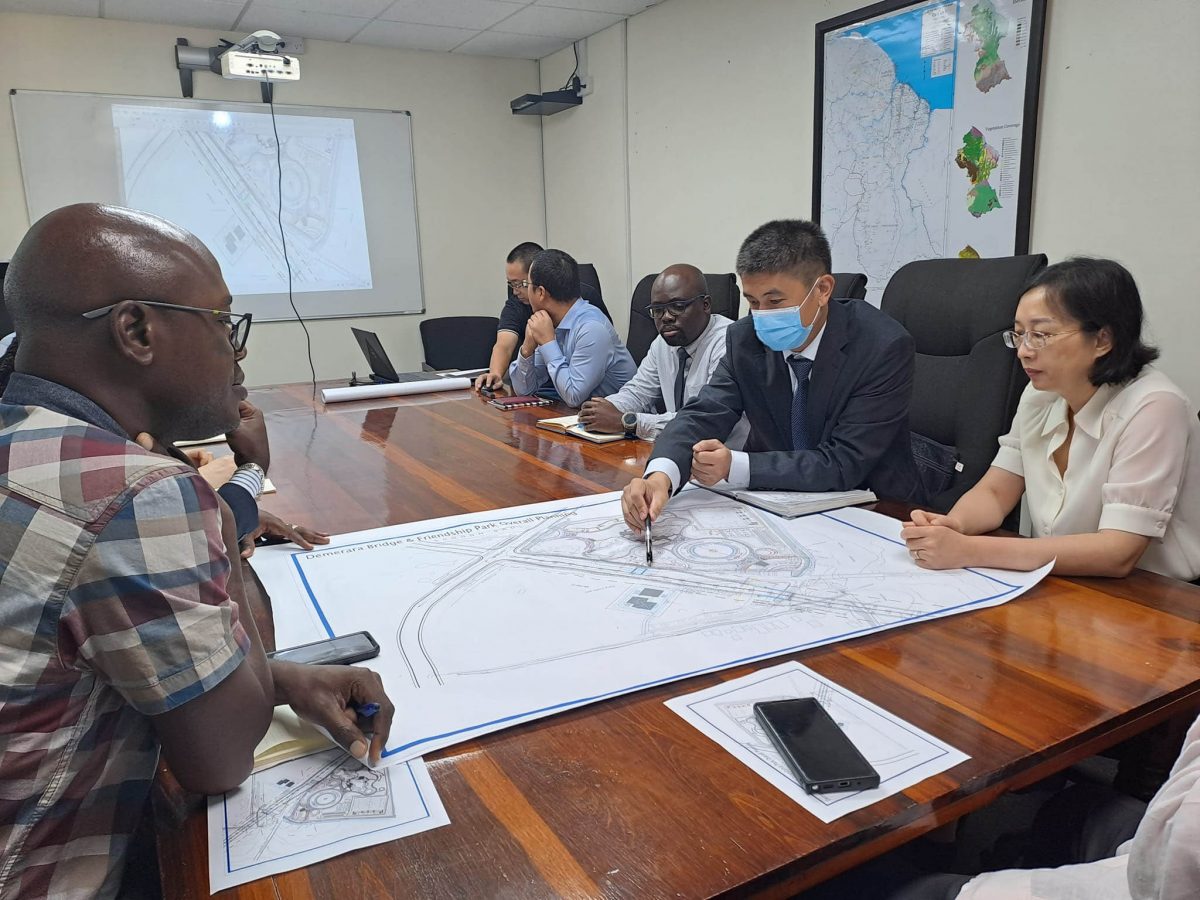 Minister of Public Works, Juan Edghill yesterday had a follow-up meeting with Chinese Ambassador to Guyana, Guo Haiyan, and officials from China Railway Construction Corporation Ltd., to finalise the design interface between the new Demerara River Bridge and the Joe Vieira Park, located at Schoonord, West Bank Demerara. 
A release from the Ministry said that the park is in close proximity to where the West Bank end of the new bridge will be constructed.  Edghill was accompanied by Chief Transport Planning Officer in the Ministry of Public Works, Patrick Thompson, and Commissioner of the Protected Areas Commission and the National Parks Commission, Jason Fraser. (Ministry of Public Works photo)