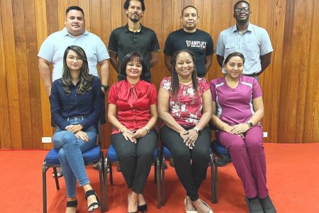 The newly elected Guyana Badminton Association Executives with President Emily Ramdhani seated second from left.
