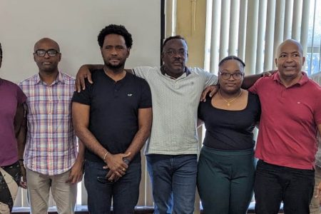 New GAPLF President, Franklin Wilson (center) flanked by Executive Committee Members from left, Roger Rogers, Keisha Abrigo, Maxwell Denny, DenroyLivan, Zanele Chase, Henry Chase, Farouk Abdool and Returning Officer, Mrs. Vidushi Persaud-McKinnon