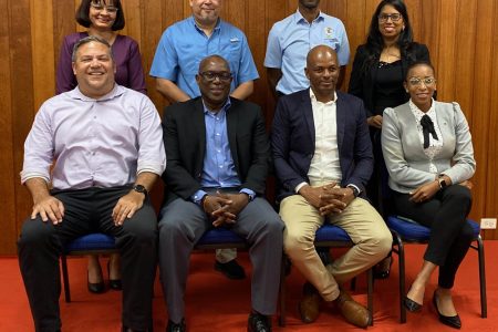The Guyana Olympic Association is now headed by Godfrey Munroe, (seated second from right). He is flanked by executive members, Vice Presidents, from left, Philip Fernandes, Steve Ninvalle and Cristy Campbell. Standing (from left) are Emelia Ramdhani, Mike Singh, Garfield Wiltshire and Vidushi Persaud-McKinnon. (Emmerson Campbell photo)