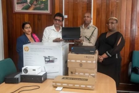 Attorney General and Minister of Legal Affairs Anil Nandlall handing over the IT equipment to Director of Prisons, Nicklon Elliot 