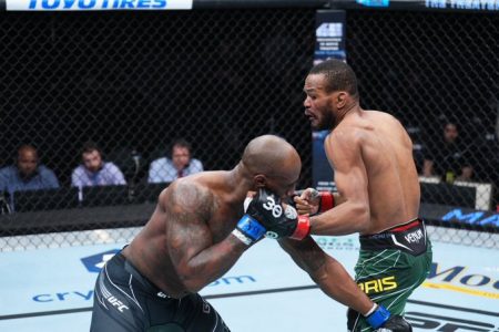 Guyanese Carlston Harris (right) connects with a left hook to the head of Jared Gooden during their catch-weight fight