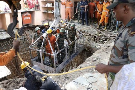 Rescuers conduct an operation at a deadly roof collapse site in Indore, India. AP