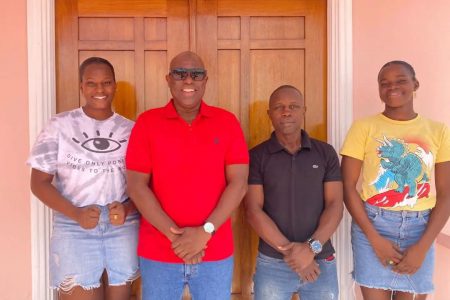 The Jackman sisters, Abiola, left, Alesha, right, Seibert Blake, second right and president of the Guyana Boxing Association Steve Ninvalle, second from left prior to their departure for the World Championships. (Photo courtesy of the Guyana Boxing Association).