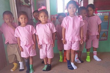 Pupils at Katoonarib Nursery School, Region Nine observing World Down Syndrome Day yesterday with the trademark brightly coloured socks.   (Ministry of Education photo)