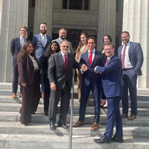 Faris Al-Rawi, second from right front, with the winning team from the New York law firm who represented T&T in the Piarco Airport civil matter, outside the Miami Dade Circuit Court yesterday.