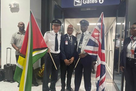 British Airways Captain, Marc Chan (left) and Alan Brooks (right) with an aviation official on Monday
