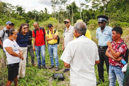 Education Minister Priya Manickchand (second from left) during discussions on a site for the school at Jawalla. (Ministry of Education photo)