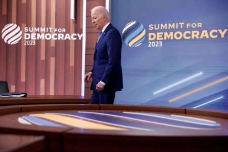 U.S. President Joe Biden arrives to deliver remarks during a virtual Summit for Democracy, which he is hosting from an auditorium on the White House campus in Washington, U.S., March 29, 2023. REUTERS/Jonathan Ernst