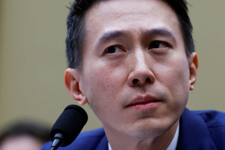 TikTok Chief Executive Shou Zi Chew looks on as he testifies before a House Energy and Commerce Committee hearing entitled "TikTok: How Congress can Safeguard American Data Privacy and Protect Children from Online Harms," as lawmakers scrutinize the Chinese-owned video-sharing app, on Capitol Hill in Washington, U.S., March 23, 2023. REUTERS/Evelyn Hockstein