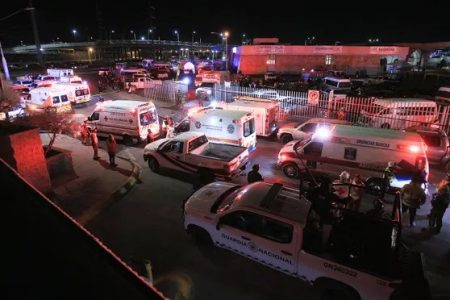Emergency services at the scene of the deadly blaze in Ciudad Juárez. Photograph: Luis Torres/EPA