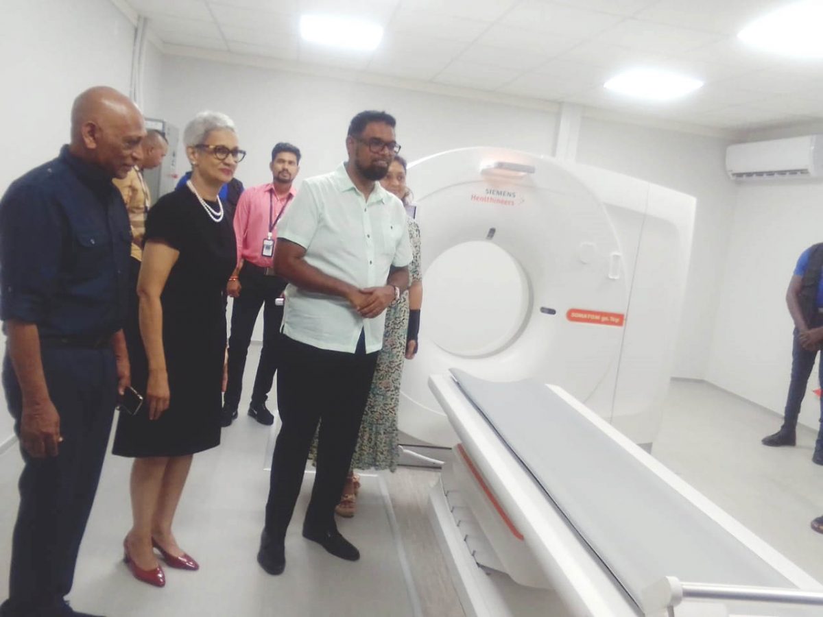 From left are Dr Leslie Ramsammy, Dr Madhu Singh and President Irfaan Ali at the launch of the 128 Slice CT Scanner