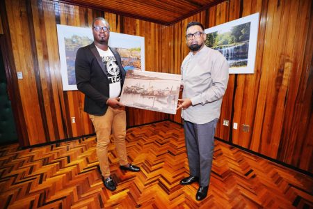 Videographer Travon Barker yesterday presented President Irfaan Ali with a photograph on canvas titled ‘ Unity Koker’.  The photograph is part of Barker’s Amanada collection. The photographer indicated that his aim is to host an exhibition to give other photographers the opportunity to showcase their work. (Office of the President photograph)