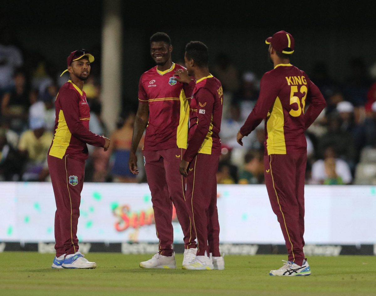 Indies cricketers from left, Nicholas Pooran, Alzarri Joseph, Akeal Hosein and Brandon King celebrate the
fall of a South African batsman’s wicket during Saturday’s second ODI which the West Indies won by 48 runs
