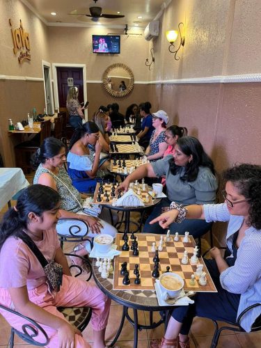 Women enjoying chess at the Java Cafe in Duncan Street
