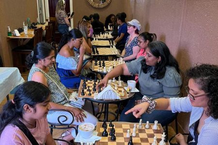 Women enjoying chess at the Java Cafe in Duncan Street
