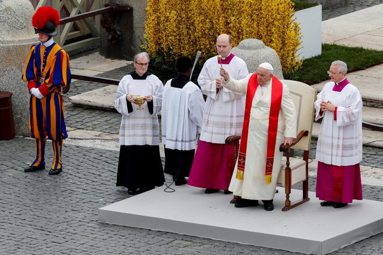 Pope Francis attends the Palm Sunday Mass in Saint Peter's Square at the Vatican, April 2, 2023. REUTERS/Remo Casilli