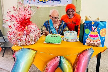 Hilton Lewis and his friend Phillip Beccles during his recent 104th birthday celebration
